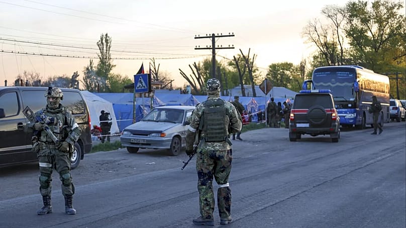 Soldiers of the Russian army and militias of the "Donetsk People's Republic" guard a warehouse in Bezimenne, 6 May 2022