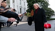 President Donald Trump talks to reporters as he departs from the South Lawn of the White House, Saturday