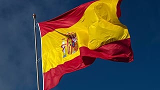 FILE - The Spanish flag flies during a memorial for coronavirus (Covid-19) victims in Madrid, Spain, on 23 October, 2020. 