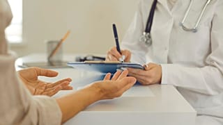 A patient talks to their doctor.
