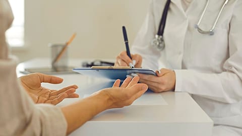 A patient talks to their doctor.