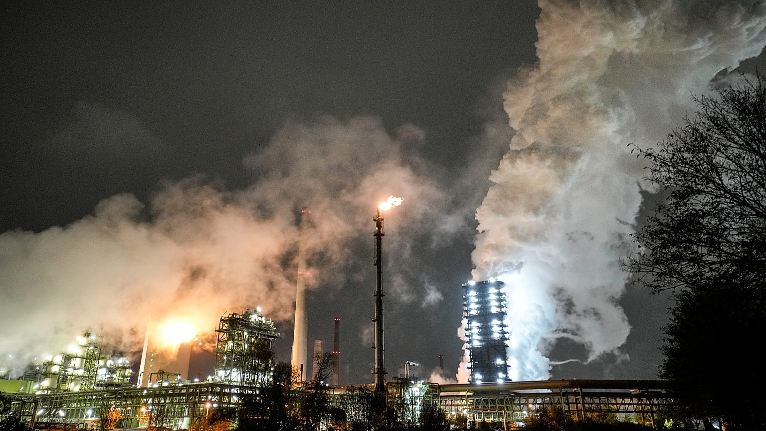 The steaming Schwelgern coking plant of German steel producer thyssenkrupp is seen at night in Duisburg, Germany,