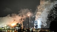 The steaming Schwelgern coking plant of German steel producer thyssenkrupp is seen at night in Duisburg, Germany,