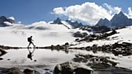 A hiker walks near the Silvretta glacier in the Swiss Alps near the town of Klosters, Switzerland in this Sept. 16, 2007 file photo.