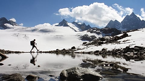 A hiker walks near the Silvretta glacier in the Swiss Alps near the town of Klosters, Switzerland in this Sept. 16, 2007 file photo.