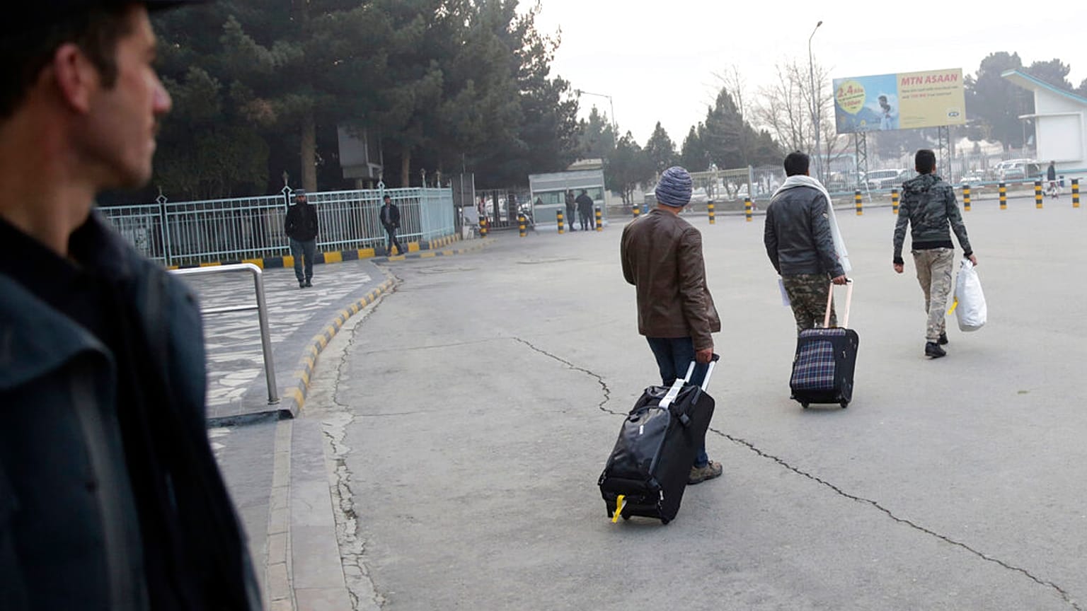 Afghans who were deported from Germany exit the Kabul International Airport, Kabul, Afghanistan, Thursday, Dec. 15, 2016. 