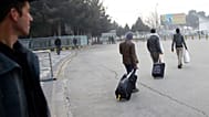 Afghans who were deported from Germany exit the Kabul International Airport, Kabul, Afghanistan, Thursday, Dec. 15, 2016. 