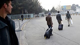 Afghans who were deported from Germany exit the Kabul International Airport, Kabul, Afghanistan, Thursday, Dec. 15, 2016. 