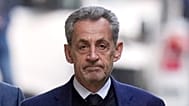 FILE - Former French President Nicolas Sarkozy leaves his home Tuesday, Oct. 21, 2025 in Paris.