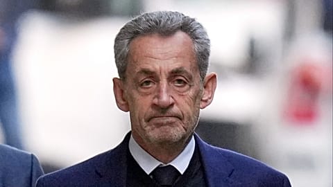 FILE - Former French President Nicolas Sarkozy leaves his home Tuesday, Oct. 21, 2025 in Paris.