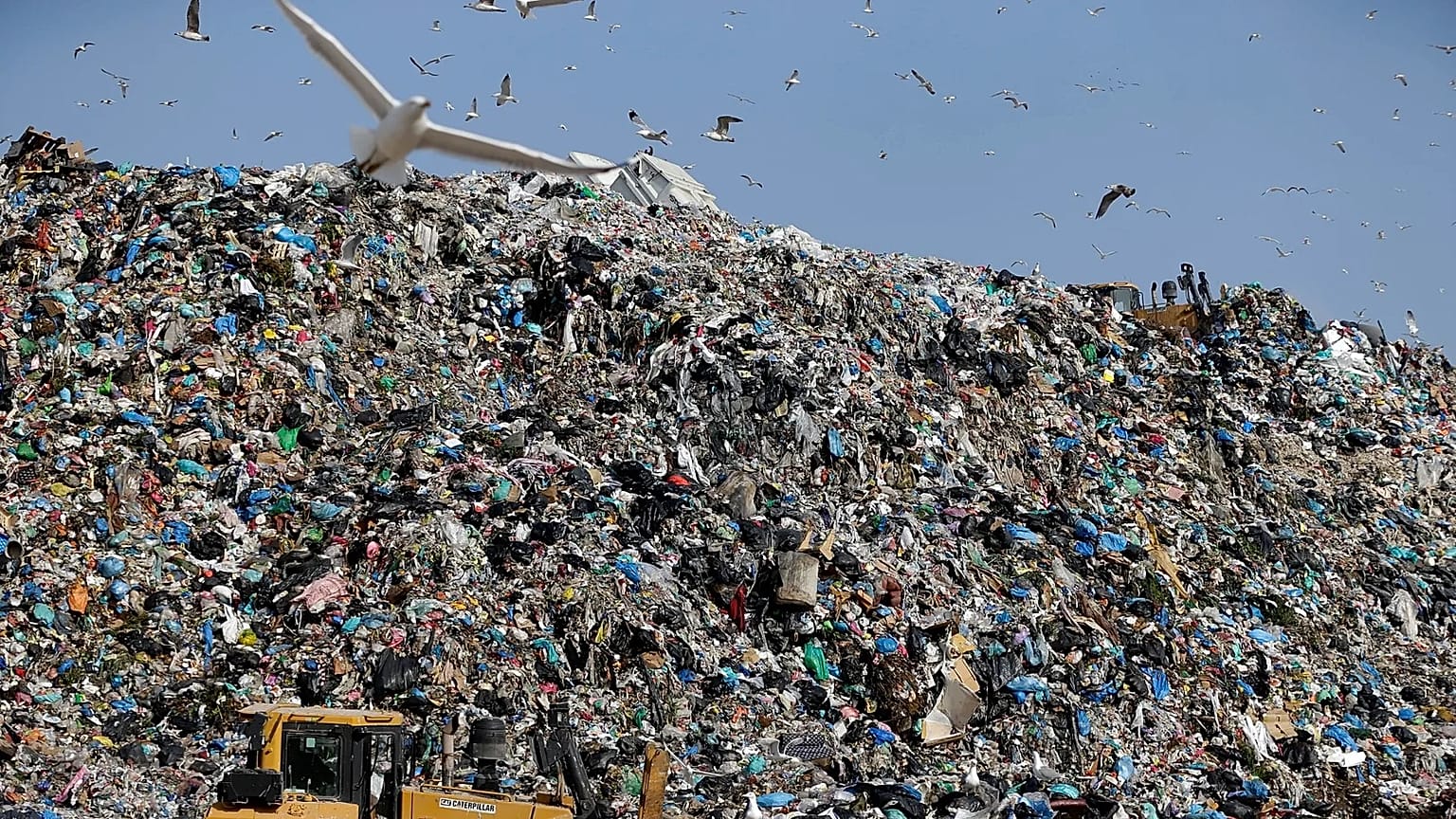 Earthmovers push mountains of garbage as seagulls fly over the country's largest landfill at Fyli on the outskirts of Athens. Feb. 2, 2018  