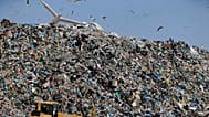 Earthmovers push mountains of garbage as seagulls fly over the country's largest landfill at Fyli on the outskirts of Athens. Feb. 2, 2018  