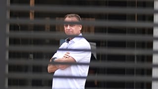FILE - Brazil's former President Jair Bolsonaro stands at the entrance of his home where he is under house arrest in Brasilia, Brazil, Tuesday, Sept. 2, 2025