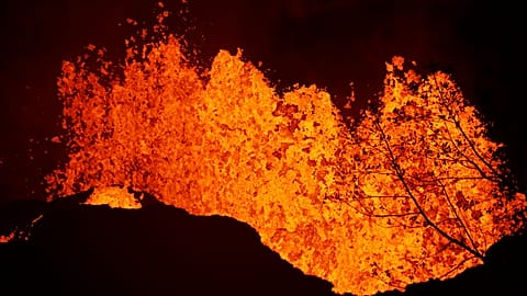 Lava erupts from a fissure in Kapoho, Hawaii Monday, May 21, 2018.
