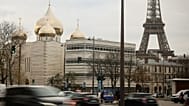 The Holy Trinity Russian Orthodox cathedral and the adjoining culture centre are seen next to the Eiffel Tower in Paris, 26 November 2025