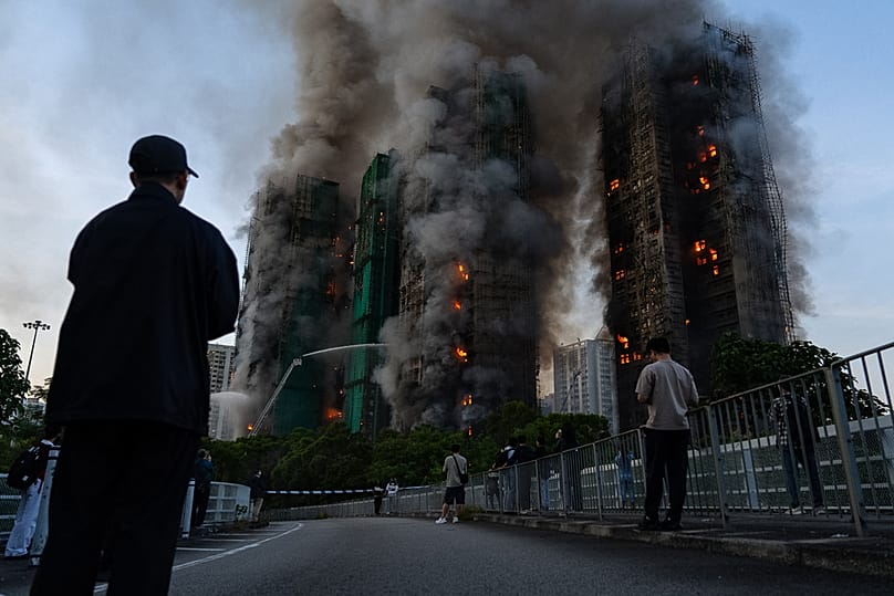 Smoke rises after a fire broke out at Wang Fuk Court, a residential estate in the Tai Po district of Hong Kong's New Territories on 26 November 2025