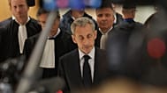 FILE: Former French President Nicolas Sarkozy speaks with the media after a Paris court sentenced him to 5 years, 25 September 2025