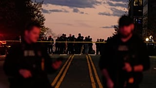 Emergency personnel keep a presence following the shooting of two National Guard soldiers near the White House, Wednesday, Nov. 26, 2025, in Washington