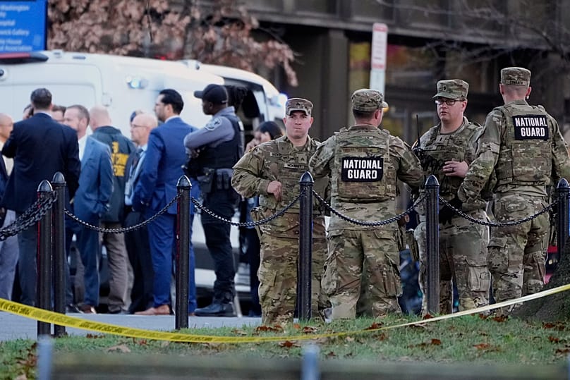 Emergency personnel gather in a cordoned off area where National Guard soldiers were shot near the White House Wednesday, Nov. 26, 2025, in Washington