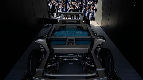 FILE. Attendees look at the next generation battery swapping station from China-based CATL, the world's largest EV battery maker in Xiamen, China. 18 Dec. 2024