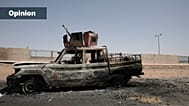 A destroyed military vehicle is seen in southern in Khartoum, Sudan, 20 April 2023