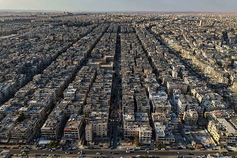 FILE: A general view shows the Sheikh Maqsoud neighborhood of Aleppo, 7 October 2025