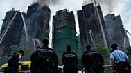 Firefighters work to extinguish a fire which broke out at Wang Fuk Court, a residential estate in the Tai Po district of Hong Kong's New Territories, Thursday, Nov. 27, 2025