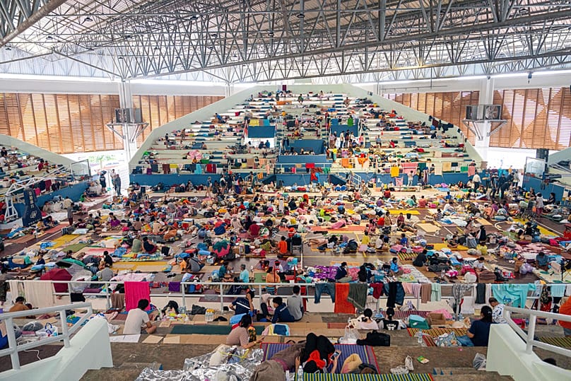 Thai residents rest at an evacuation center following floods in Songkhla province, southern Thailand, Thursday, Nov. 27, 2025