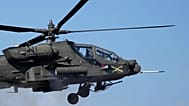 FILE: A US Army AH-64 Apache helicopter fires rocket during a combined live fire drill at Rodriguez Live Fire Complex in Pocheon, 30 October 2024. 