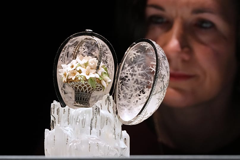 Margo Organesian looks towards the Winter Egg by Faberge as it is displayed at Christie's auction rooms in London, 27 November 2025.