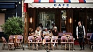 FILE. A waiter at a cafe in Paris. Tuesday, 29 July 2025.