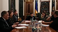 Ukraine's President Volodymyr Zelenskyy, surrounded by administration officials, speaks during a news conference in Kyiv, Ukraine, Monday, Nov. 3, 2025.