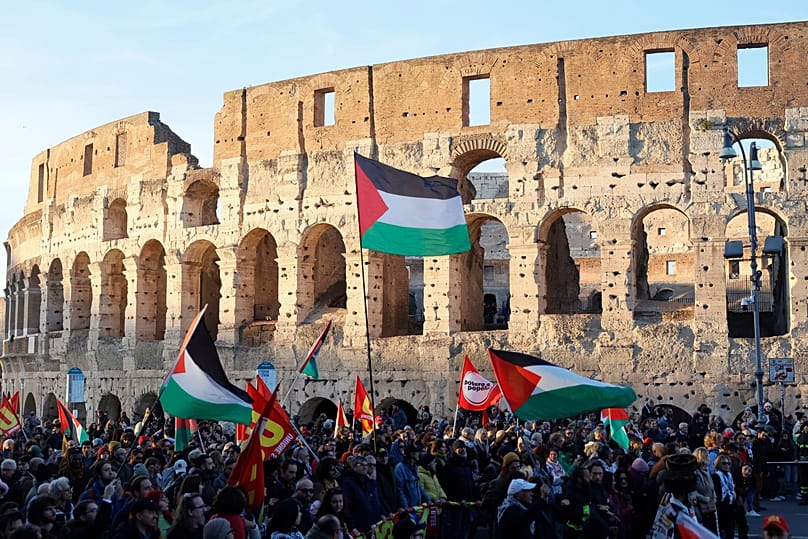 Activists attend the International Day of Solidarity with the Palestinian People, in Rome, Saturday, Nov. 29, 2025. 