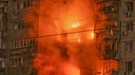 Fire rages after a Russian missile hit a multi-story residential building in Vyshgorod, outside of Kyiv, Ukraine, early Sunday, Nov. 30, 2025.