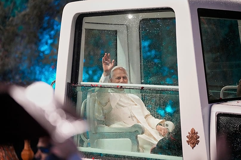 Pope Leo XIV waves as he arrives for a welcoming ceremony at the presidential palace in Baabda, east of Beirut, Lebanon, Sunday, Nov. 30, 2025.