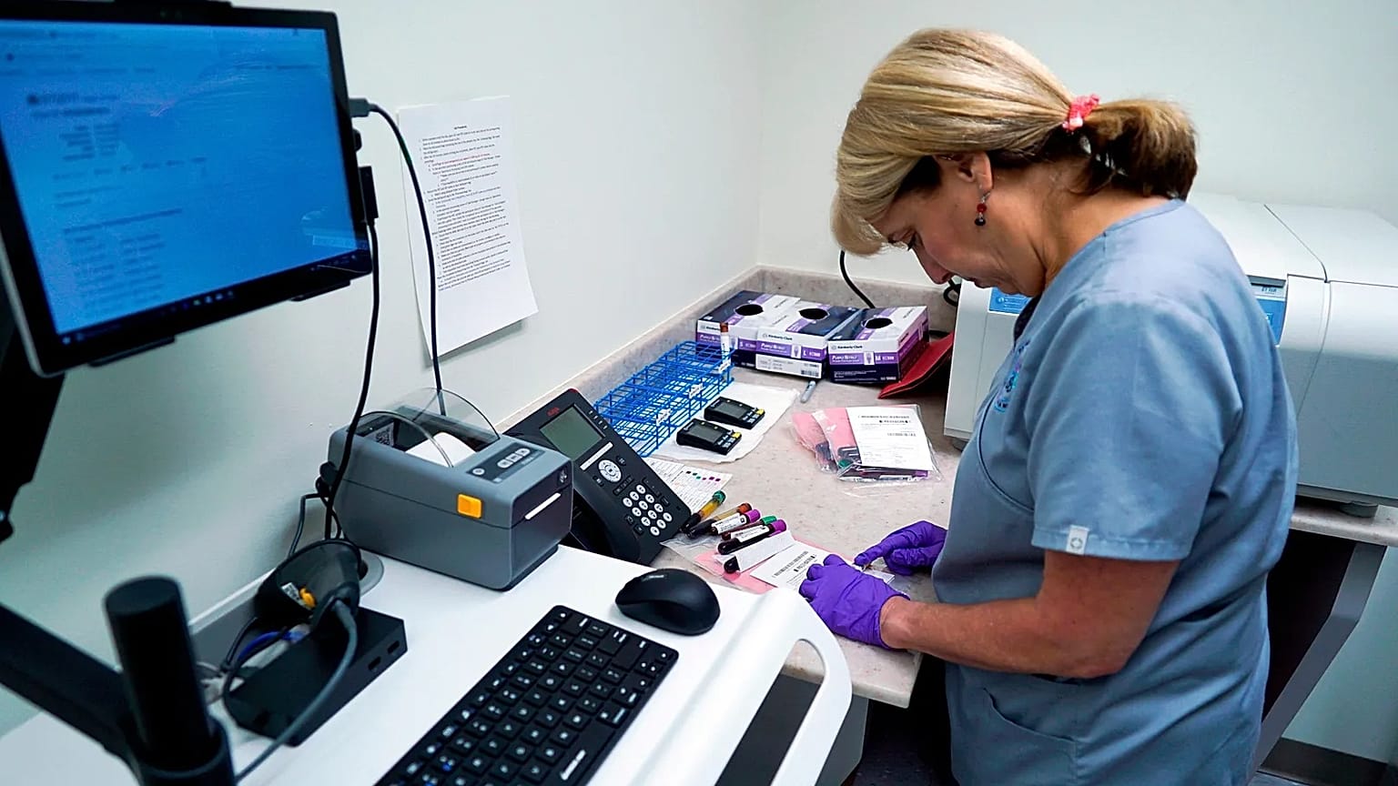 In this file photo taken on 7 August 2017, Stephanie Richurk, a nurse at the University of Pittsburgh Medical Center, sorts blood samples.