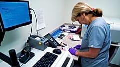 In this file photo taken on 7 August 2017, Stephanie Richurk, a nurse at the University of Pittsburgh Medical Center, sorts blood samples.