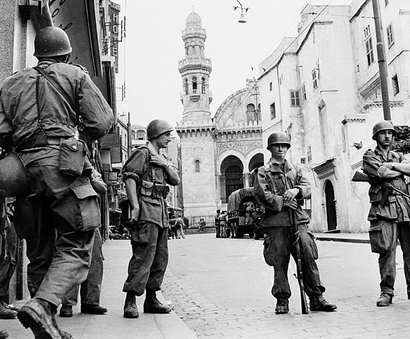 FILE - In this May 27, 1956 photo, French troops seal off Algiers' notorious casbah, 400-year-old teeming Arab quarter.