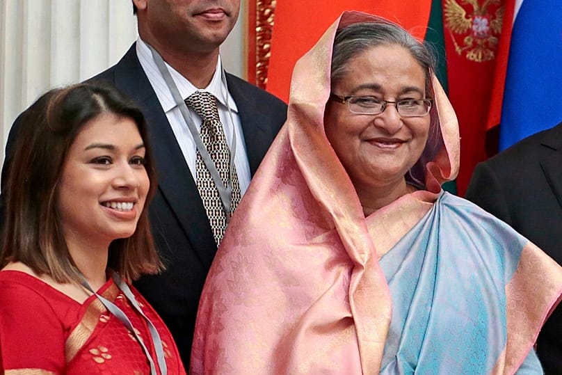 Tulip Siddiq, left, stands beside Bangladeshi Prime Minister Sheikh Hasina in the Kremlin in Moscow, 15 January, 2013
