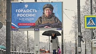 A billboard depicting a Russian soldier fighting in Ukraine. St. Petersburg, Russia, 24 November 2025.