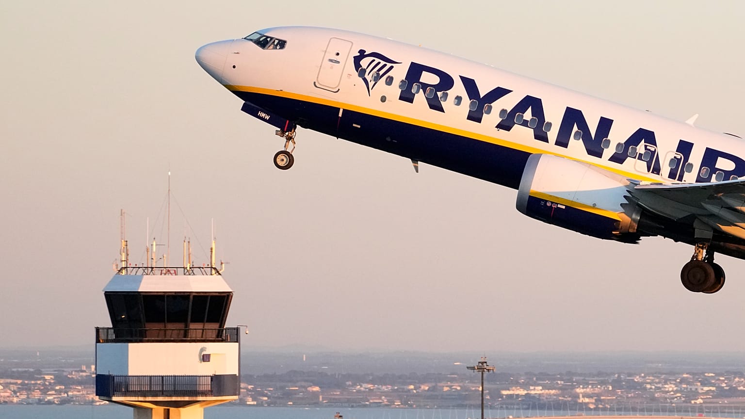 A Ryanair Boeing 737 MAX takes off from Lisbon airport.