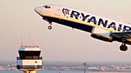 A Ryanair Boeing 737 MAX takes off from Lisbon airport.