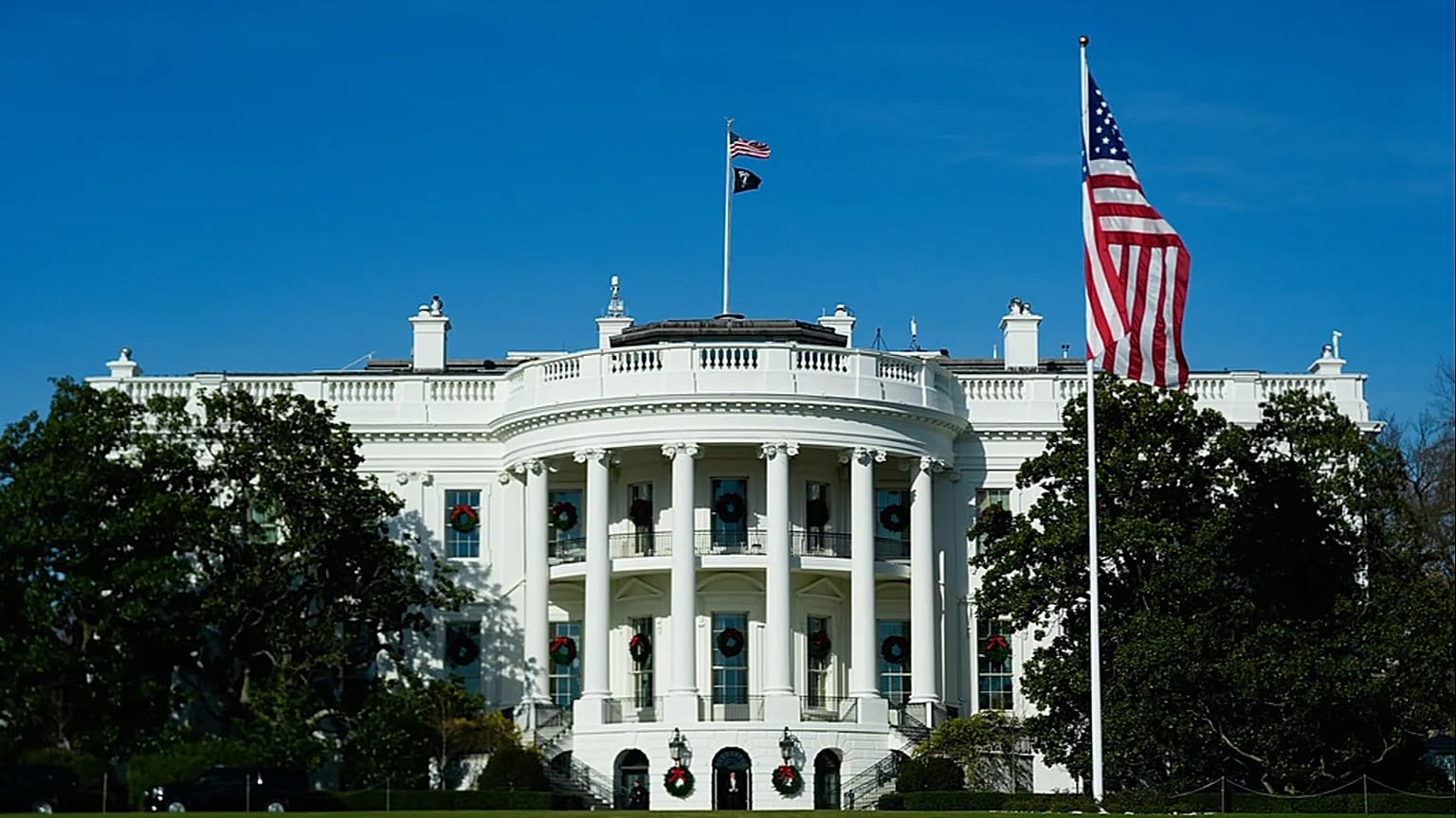 Wreaths decorate the White House, Monday, Dec. 1, 2025, in Washington. (AP Photo/Julia Demaree Nikhinson)