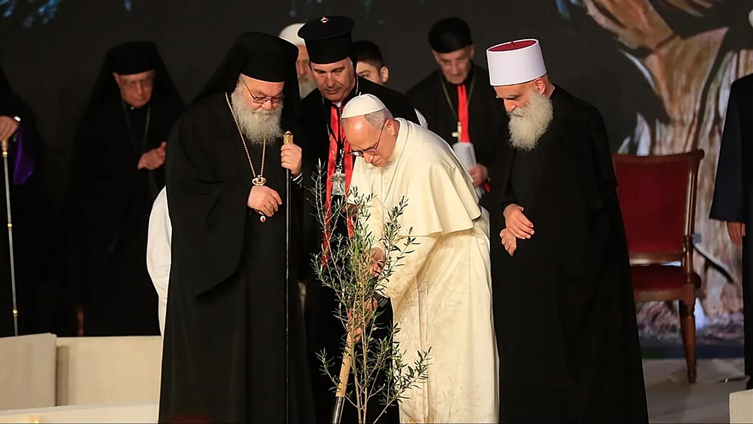 Pope Leo XIV plants an olive tree, flanked by Greek Orthodox Patriarch of Antioch John X Yazig
