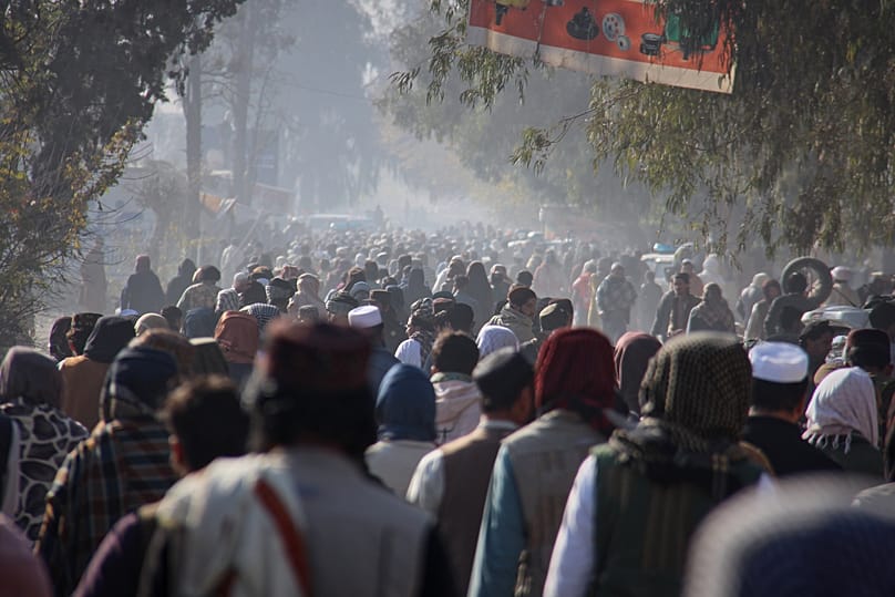 A crowd heads towards a stadium to attend a public execution in the eastern city of Khost, 2 December, 2025