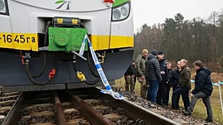 FILE: Prime Minister Donald Tusk, second right, visits site of the rail line Mika, that was damaged by sabotage, near Deblin, Poland, Monday, Nov. 17, 2025.