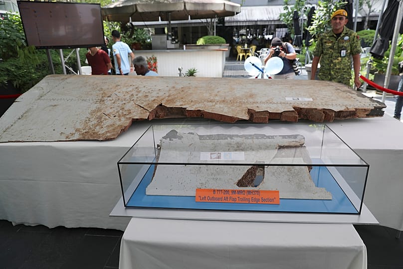 FILE - Debris from the missing Malaysia Airlines Flight MH370 is displayed during a Day of Remembrance for MH370 event in Kuala Lumpur, Malaysia, on March 3, 2019.