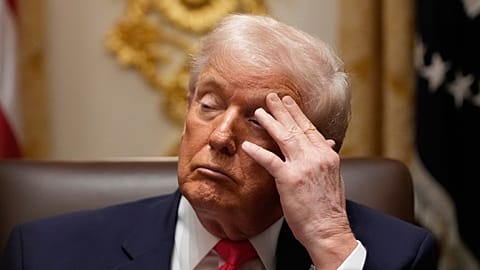 President Donald Trump listens during a Cabinet meeting at the White House, Tuesday, Dec. 2, 2025, in Washington. (AP Photo/Julia Demaree Nikhinson)