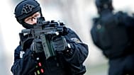FILE: A Police officer holds a weapon during a training operation of the new BFE+ unit of the German federal police in Ahrensfelde near Berlin, 16 December 2015