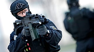 FILE: A Police officer holds a weapon during a training operation of the new BFE+ unit of the German federal police in Ahrensfelde near Berlin, 16 December 2015